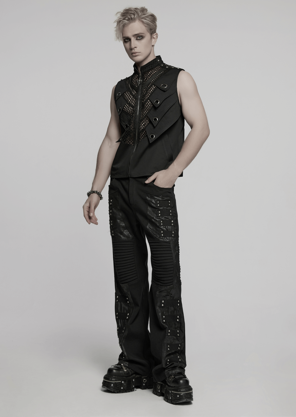 Black gothic pants with pleated panels and rivets, showcasing a punk street style for a bold fashion statement.