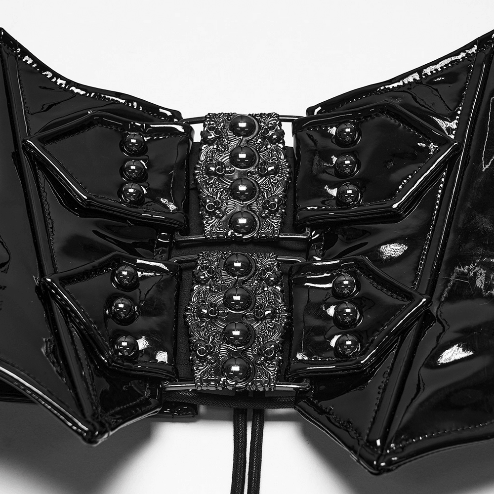 Black Gothic Patent Corset Belt with Skull Buckles showcasing intricate detailing and lacing.
