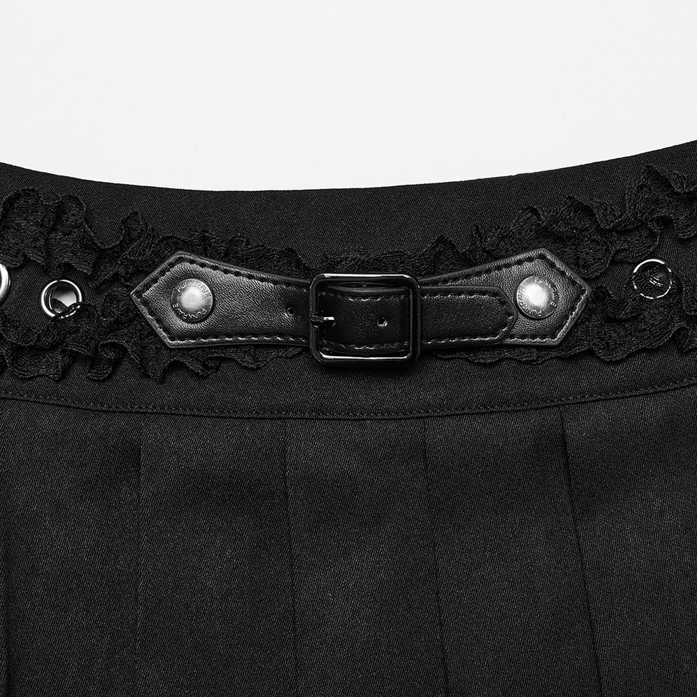 Close-up of black gothic pleated skirt with lace trim and buckle closure for an edgy punk style.