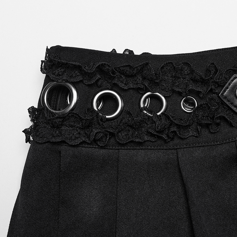 Close-up of black gothic mini skirt waist with lace trim and eyelet accents, showcasing edgy punk style and buckle detail.