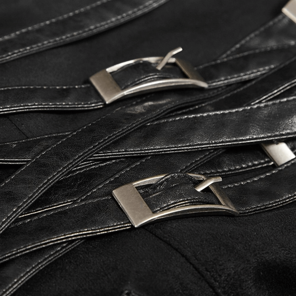Close-up of black PU leather straps with metal buckles on a gothic punk long skirt for a rebellious look.