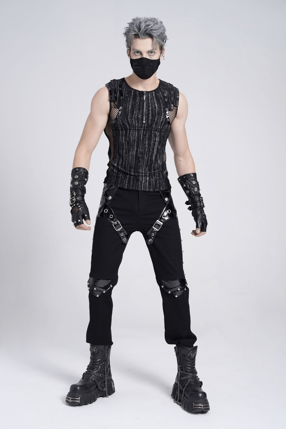 Model in black gothic punk pants with buckles and straps, showcasing edgy, rebellious style.