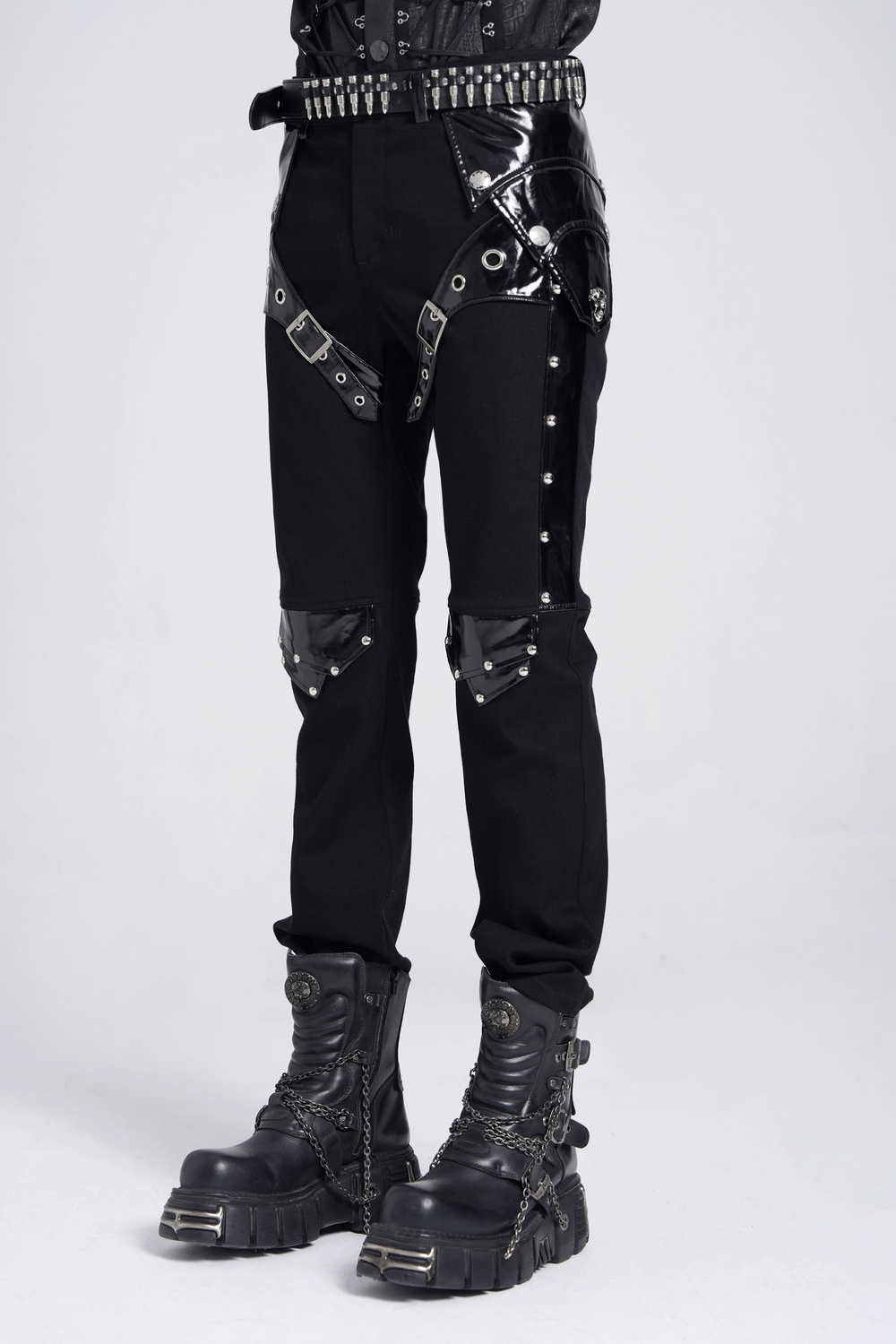 Black gothic punk pants with studded buckle and strap details, paired with edgy combat boots.