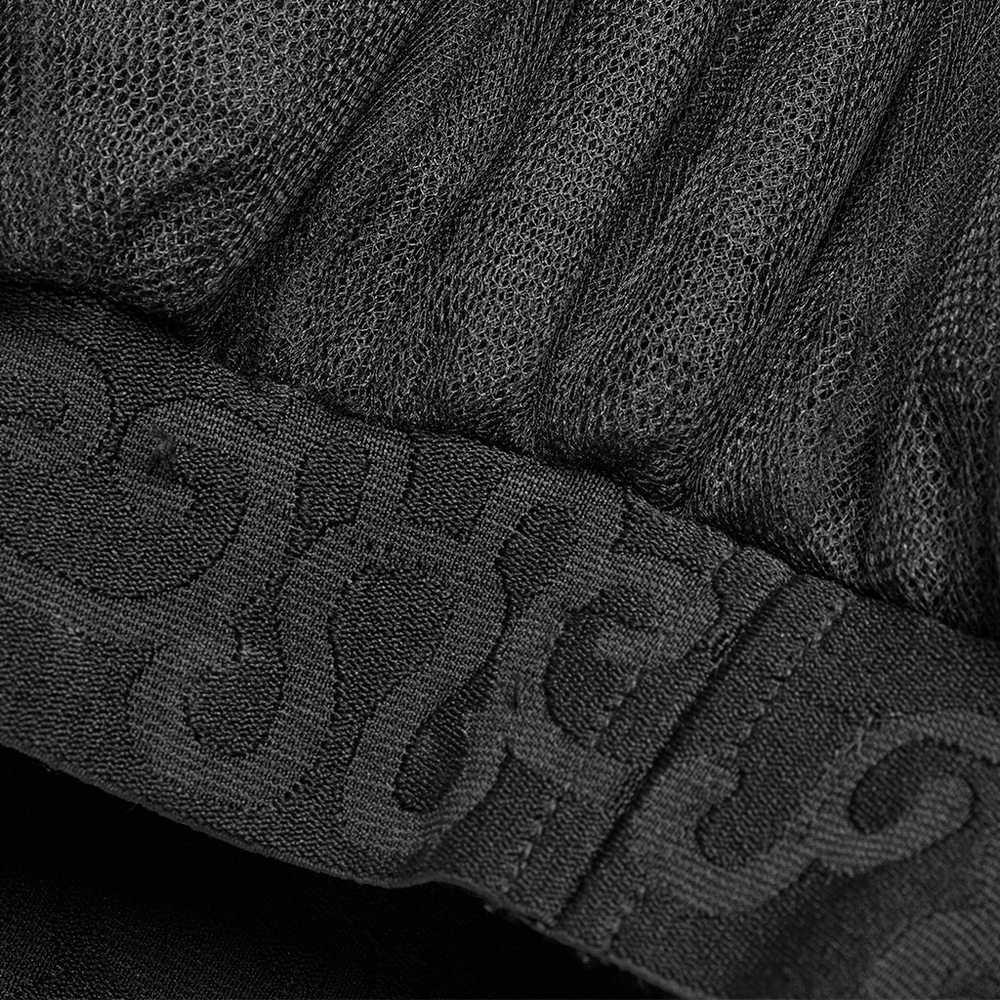 Close-up of the black mesh fabric and elastic waist of a Gothic Punk Rave skirt, showcasing intricate texture.