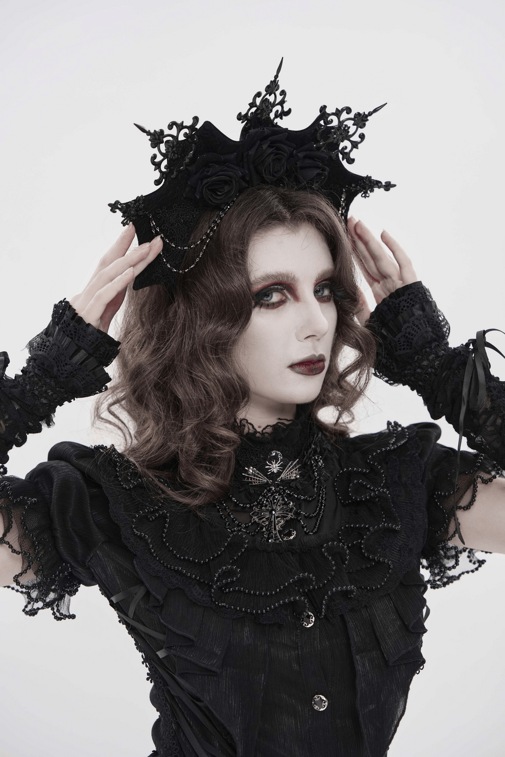 Black Gothic Rose Crown Headpiece With Lace Wings worn by a model in gothic attire.