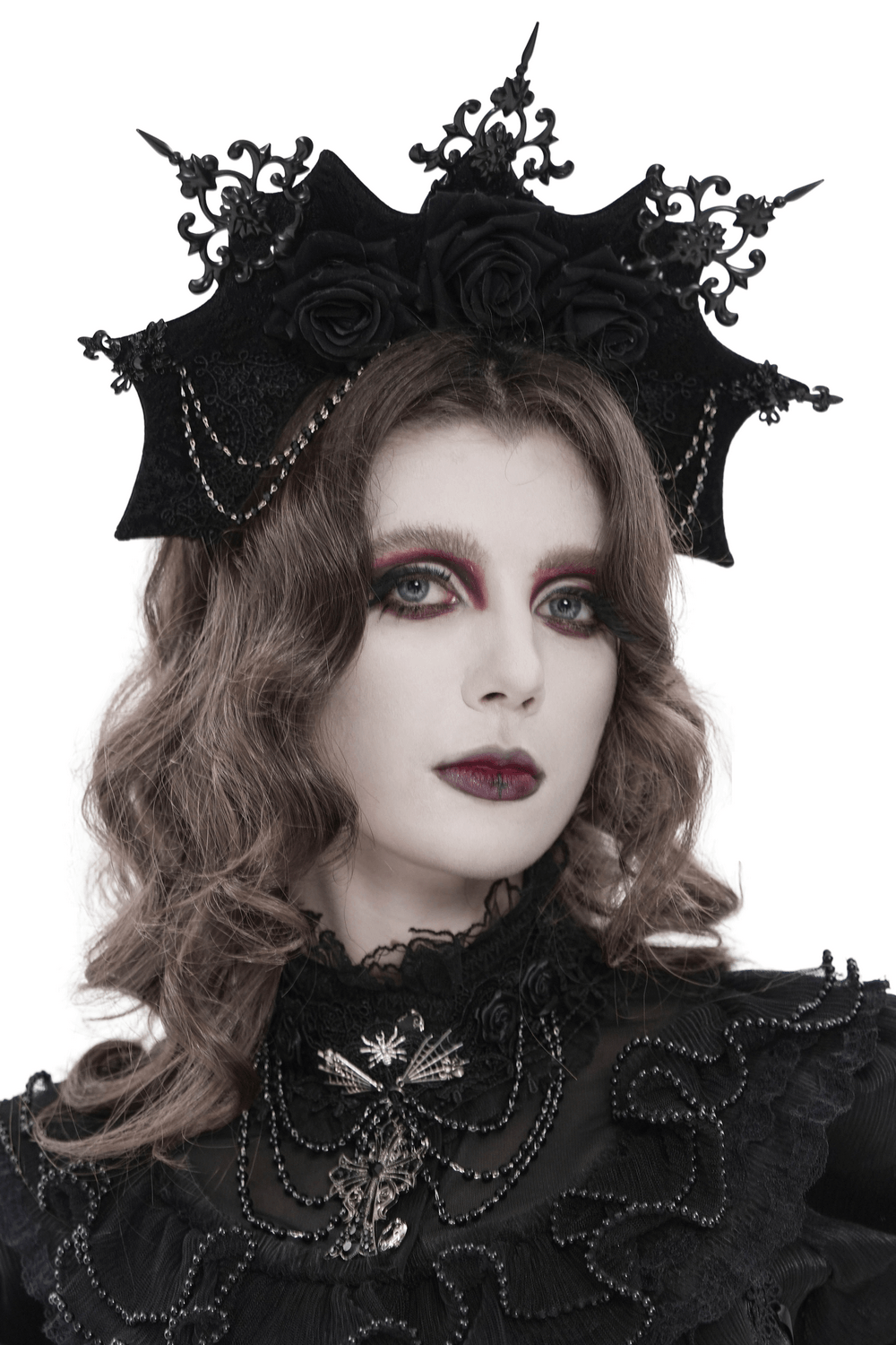 Black Gothic Rose Crown Headpiece With Lace Wings worn by a model, featuring dark floral design and lace accents.