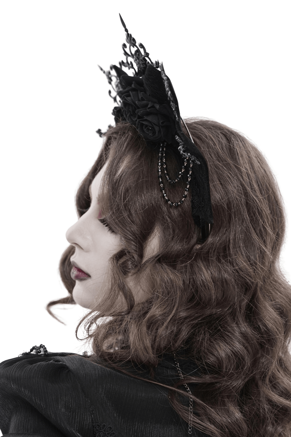 Black Gothic Rose Crown Headpiece With Lace Wings worn by a model, showcasing its dark floral and lace design.