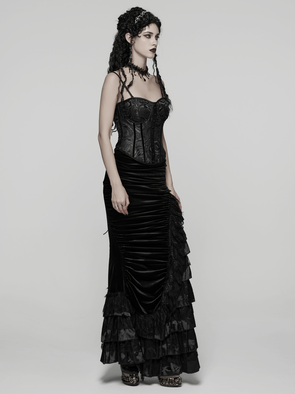Black Gothic Rose Jacquard Corset with Lace-Up Back, styled elegantly with a long black skirt in a gothic fashion look.