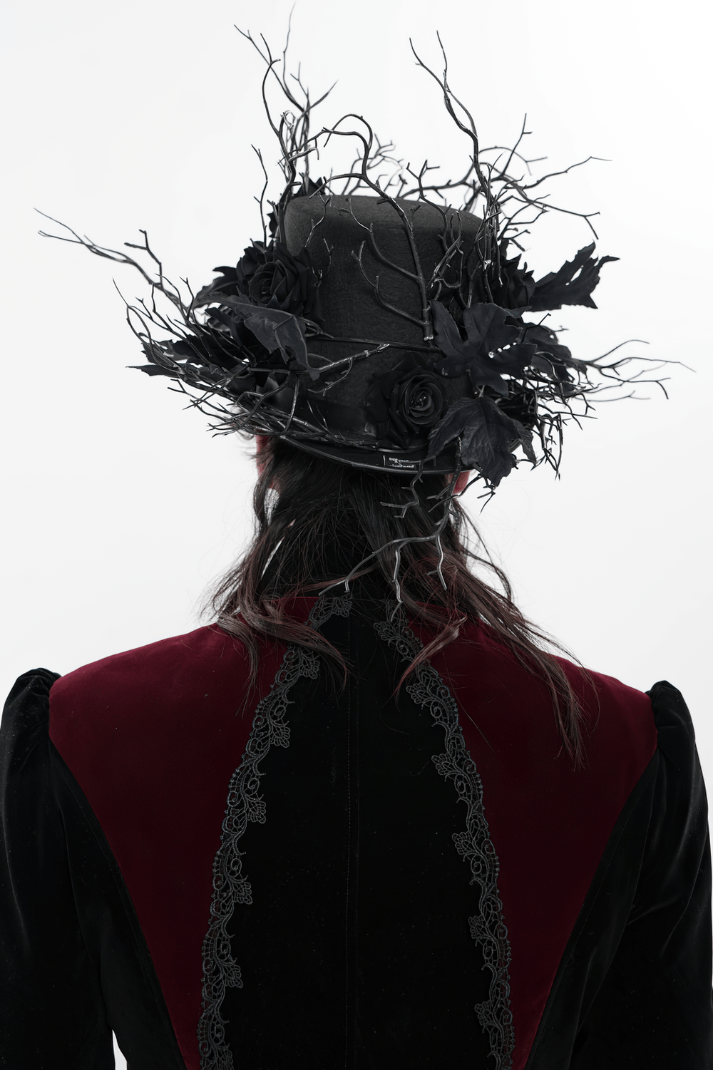 Black Gothic Rose Top Hat with Branch Crown Trim worn from the back, showcasing dark roses and twig accents.
