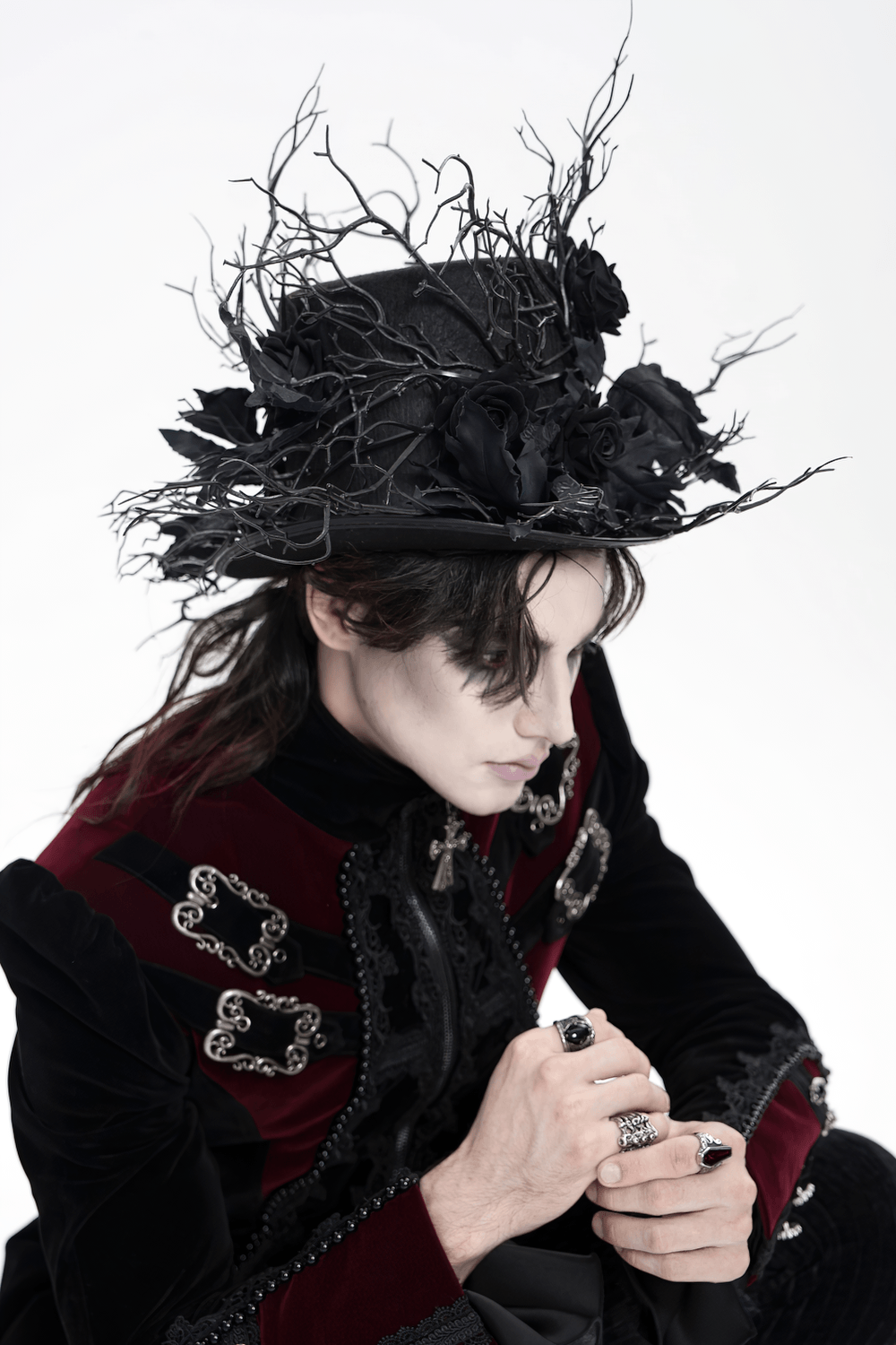 Black Gothic Rose Top Hat with Branch Crown Trim worn by a model in a dark Victorian outfit.