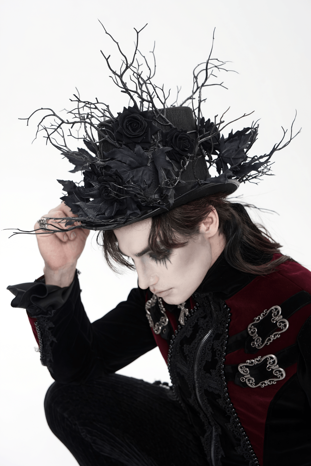 Black Gothic Rose Top Hat with Branch Crown Trim worn by a model with a dark, dramatic style.