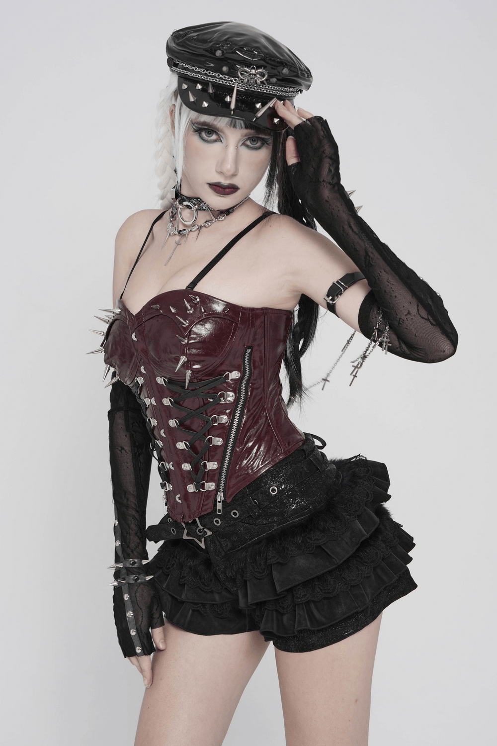 Black Gothic Ruffle Skort with Star Belt Detail styled with a gothic corset and striking accessories.