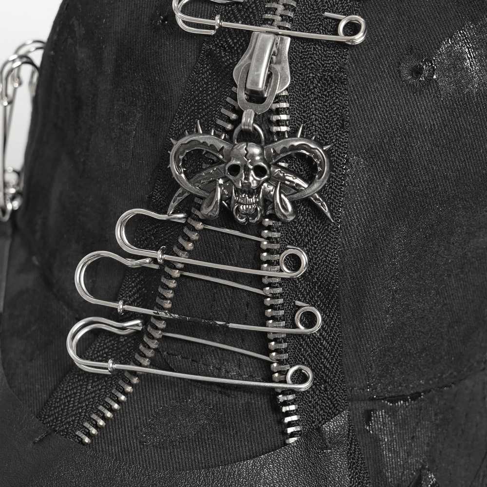 Black Gothic Safety Pin and Chain Baseball Cap showcasing zippers, safety pins, and a skull charm for edgy style.