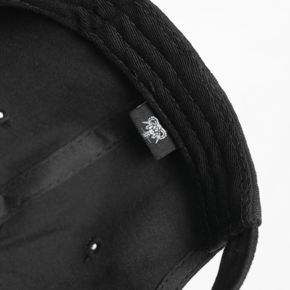 Inside view of the Black Gothic Safety Pin and Chain Baseball Cap showcasing its unique style and brand label.