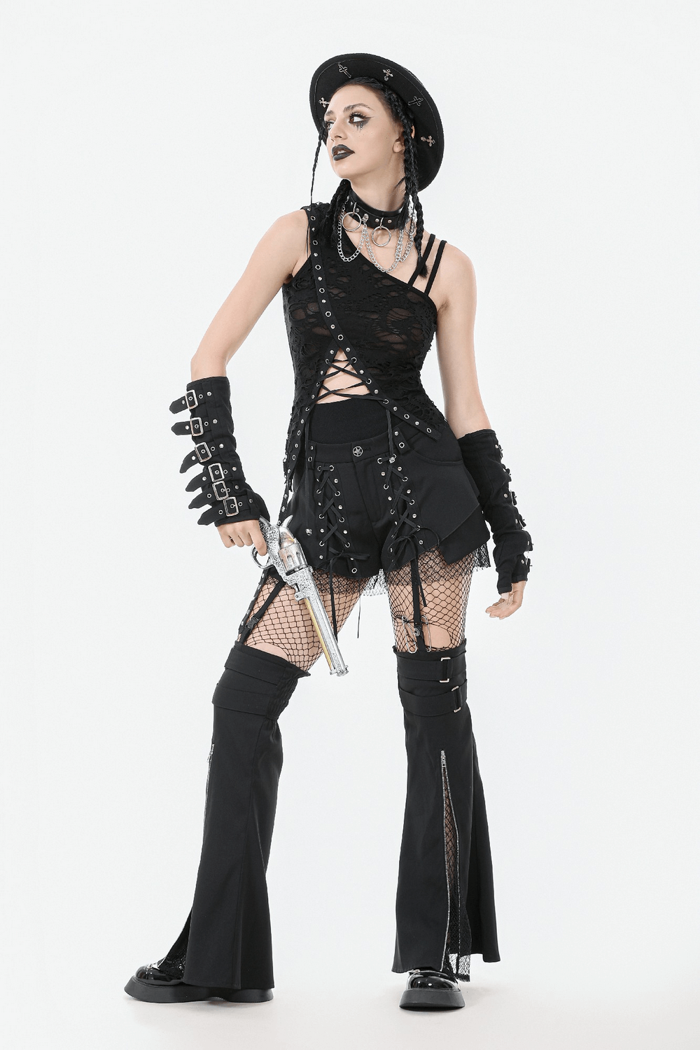 Model showcasing black gothic shorts with straps and detachable flares, embodying punk and cyber street fashion.