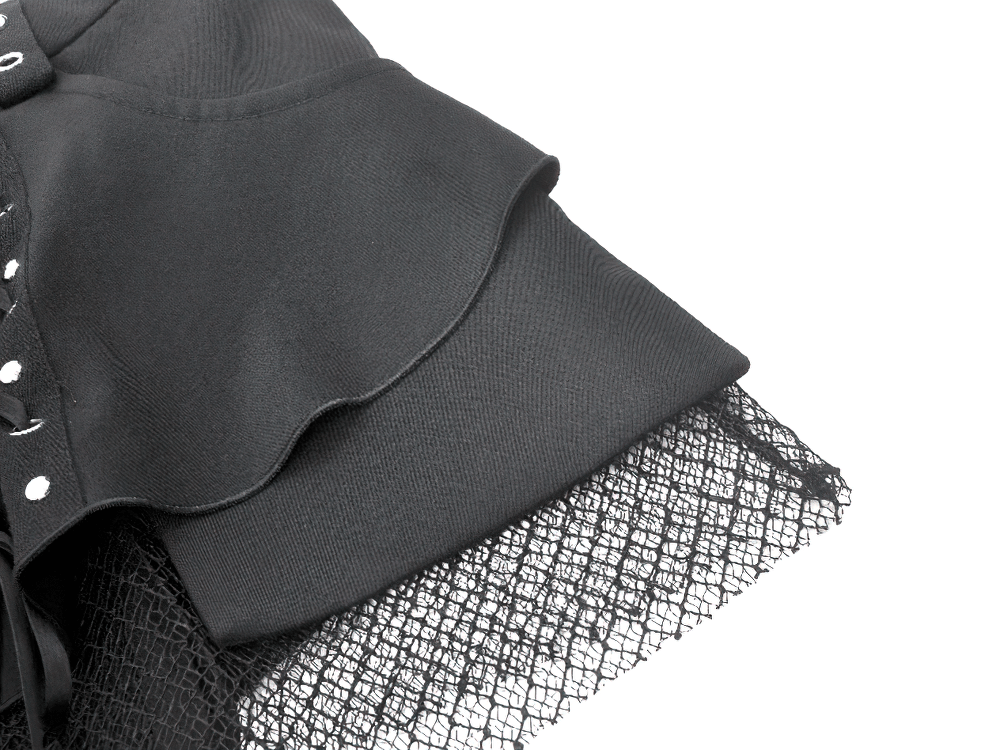 Close-up of black gothic shorts with lace-up detail, mesh accents, and detachable flares showcasing edgy design.