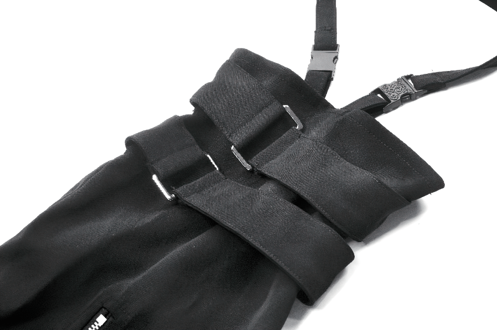 Close-up of black gothic shorts featuring adjustable straps and bold layered design for a punk look.