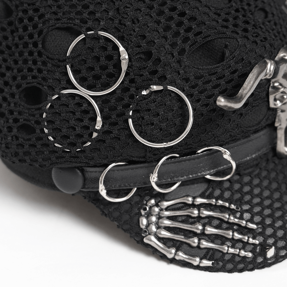 Detail of Black Gothic Skull Studded Distressed Mesh Beret showing silver chains, spikes, and metal rings.