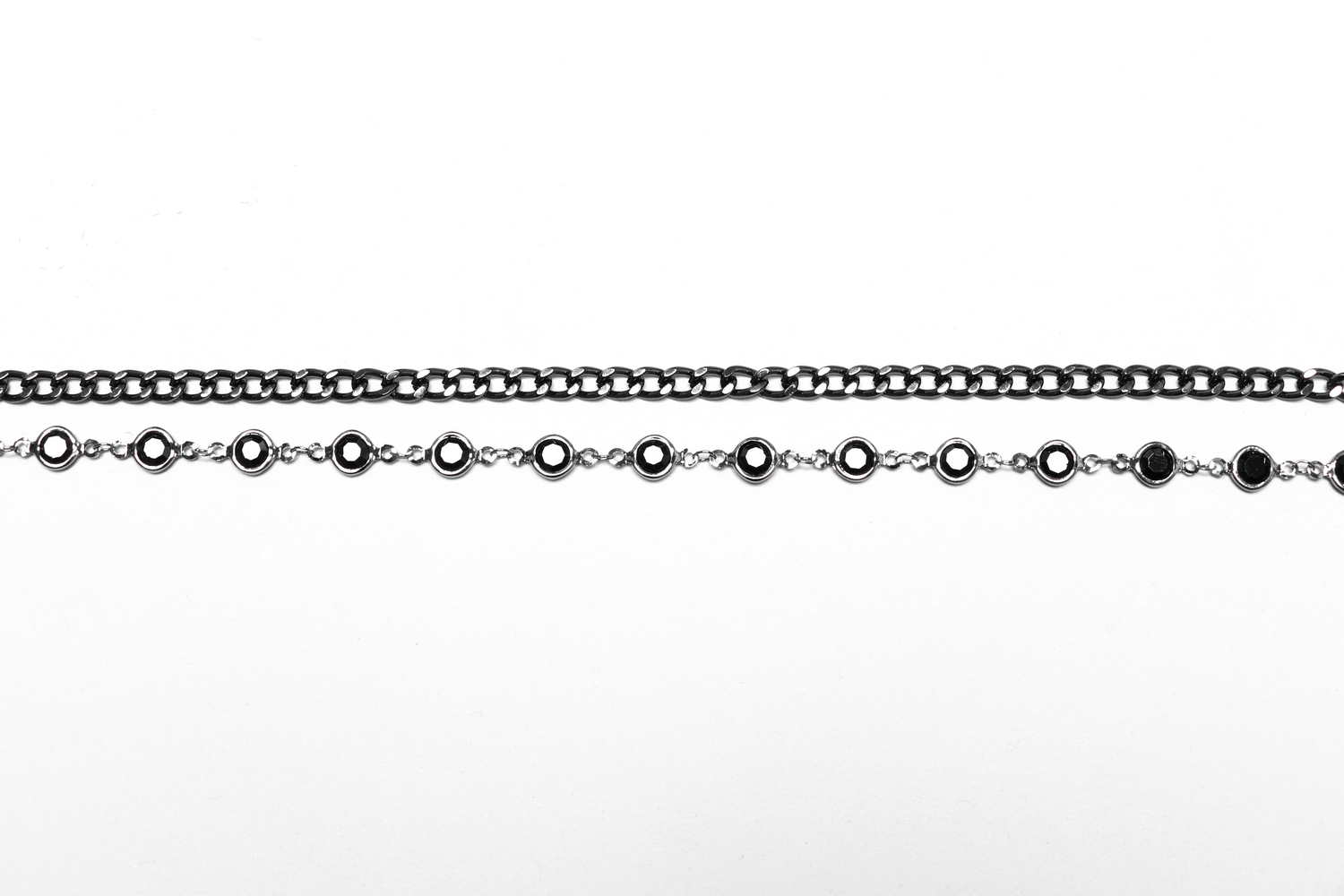 Stylish black chains with alternating round colored stones for a gothic fashion look.