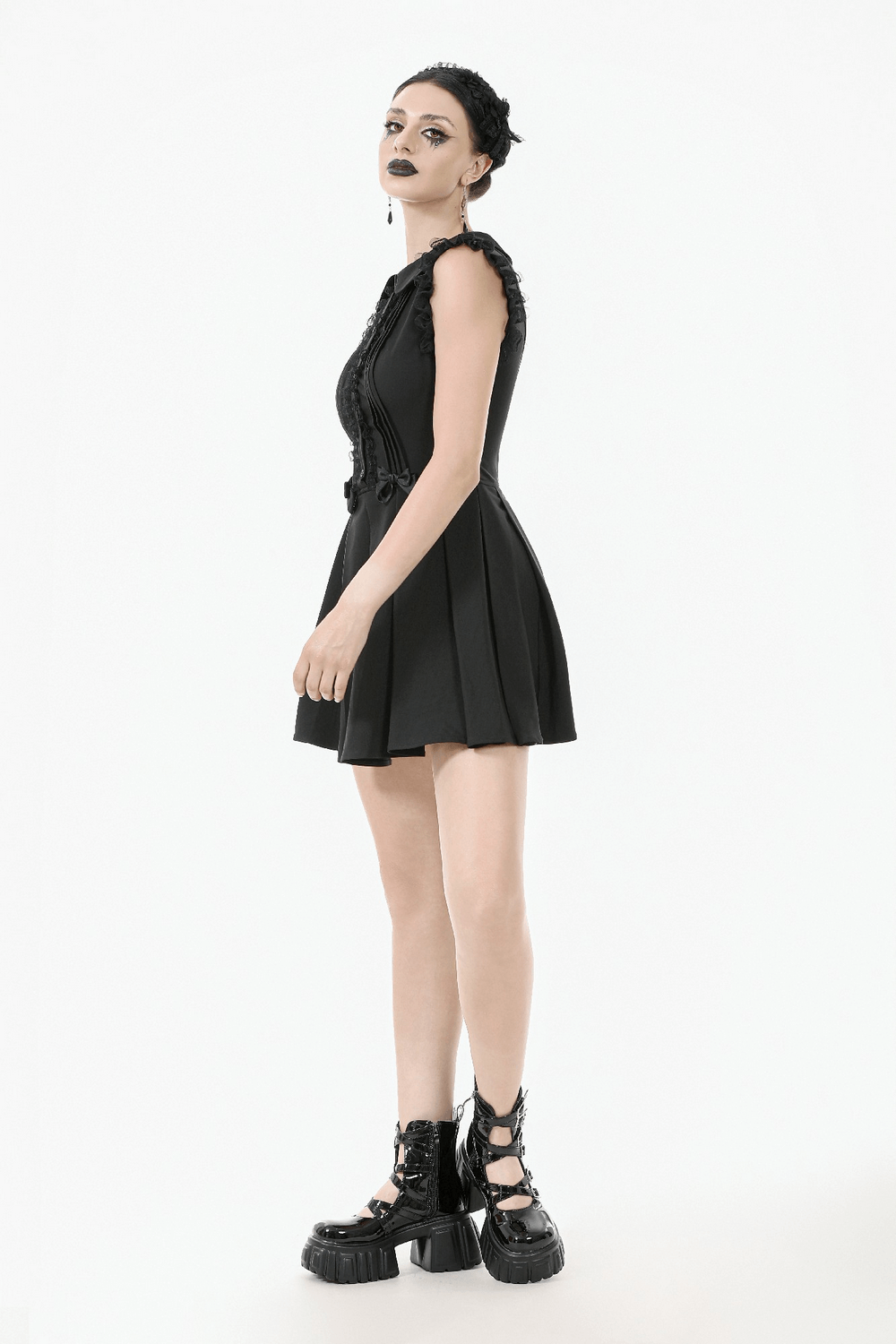 Black Gothic sleeveless dress with lace trim, pleated skirt, and bows, perfect for punk and alt fashion.
