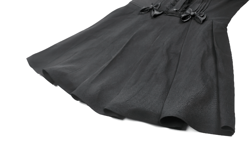 Black gothic sleeveless dress with lace trim, pleated A-line skirt, and bow accents.