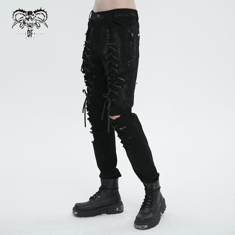 Black gothic slim-fitted pants for men with lace-up thighs and ripped knees, showcasing edgy fashion.