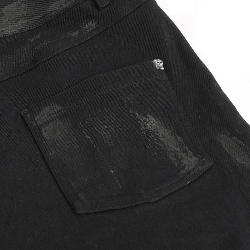Close-up of the back pocket of black gothic slim-fitted pants for men, featuring stylish distressed detailing.