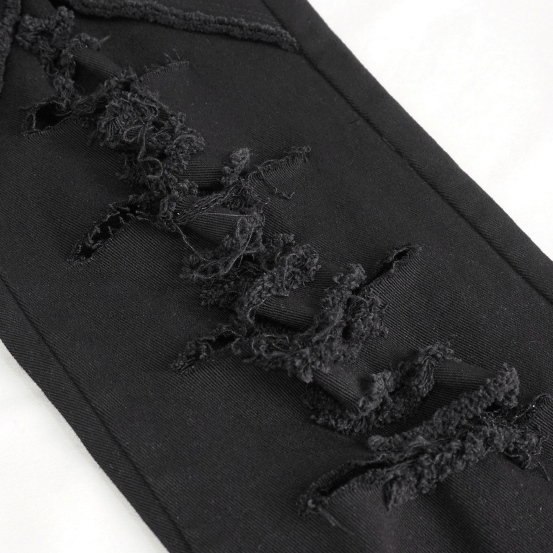 Close-up of black gothic slim-fitted pants with lace-up detailing and ripped fabric for a stylish, edgy look.