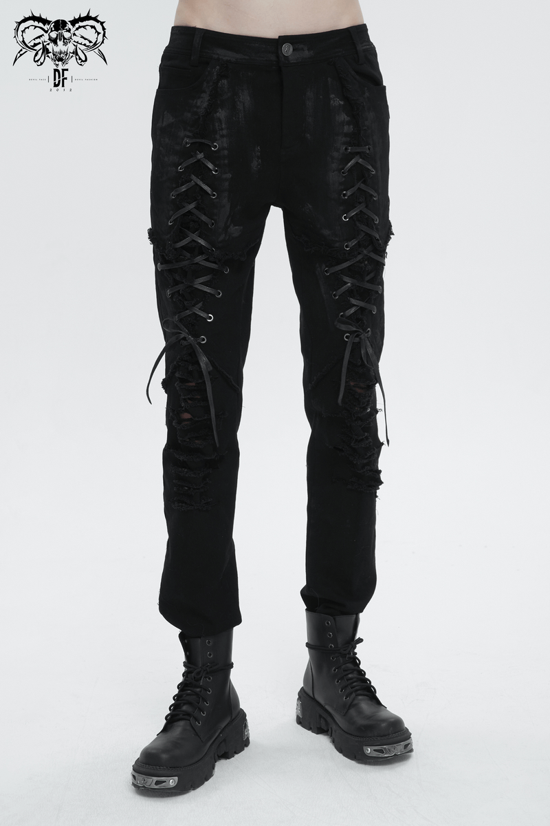 Men's black gothic slim-fit pants with lace-up thighs and ripped knees, perfect for a daring, edgy look.