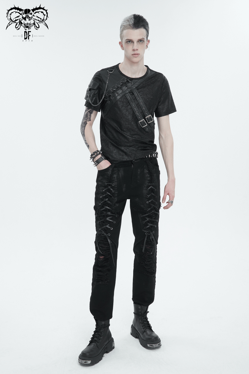 Men's black gothic slim-fitted pants with lace-up detail and ripped knees, styled with a matching black t-shirt.