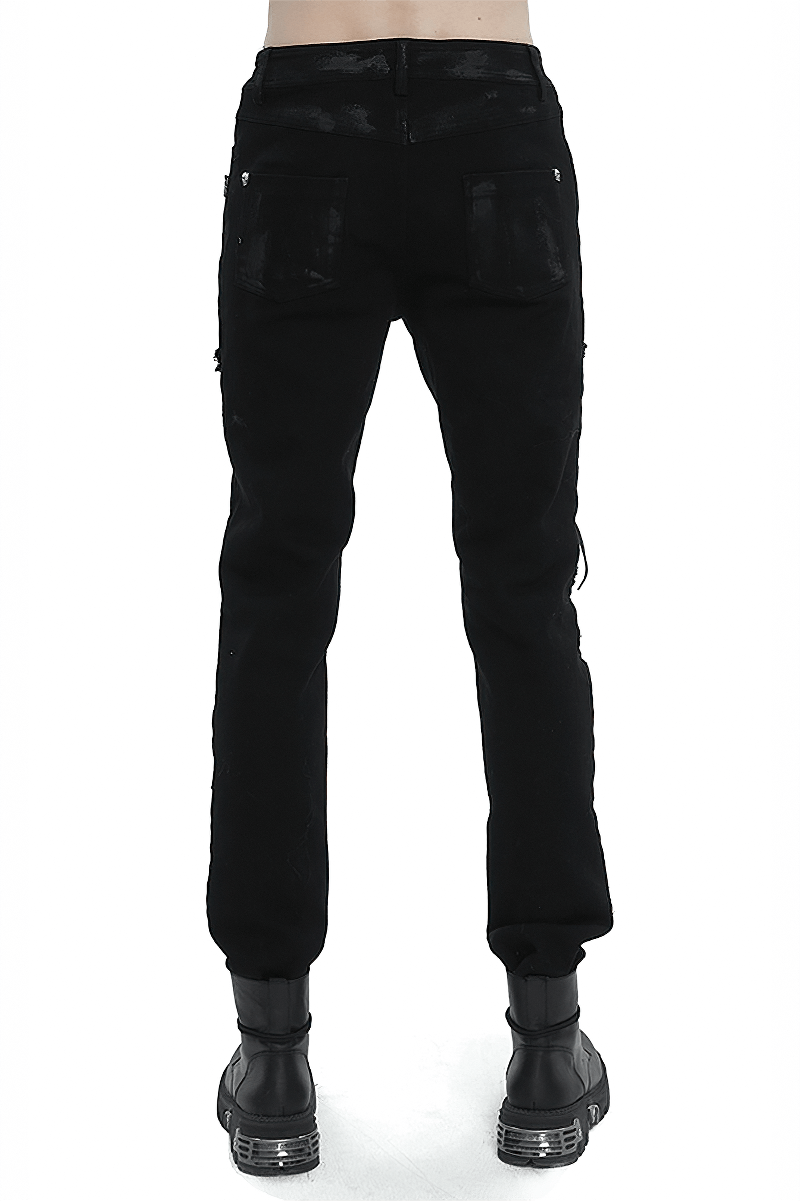 Back view of men's black gothic slim-fitted pants with ripped knees and stylish lace-up detailing.
