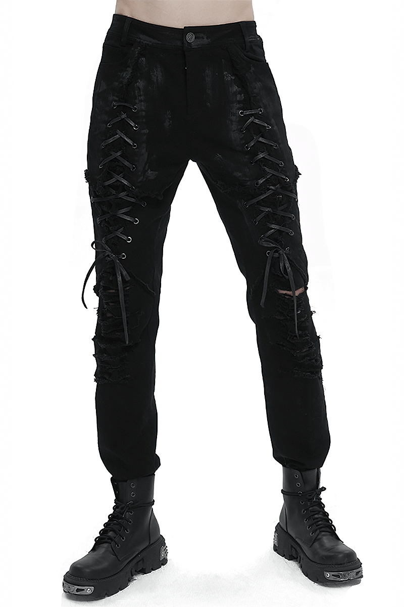 Men's black gothic slim-fitted pants with lace-up thighs and ripped knees, perfect for a bold, edgy look.