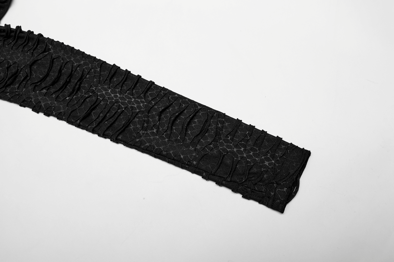 Close-up of the textured black snake print fabric showcasing its unique layered design and ruffled detailing.