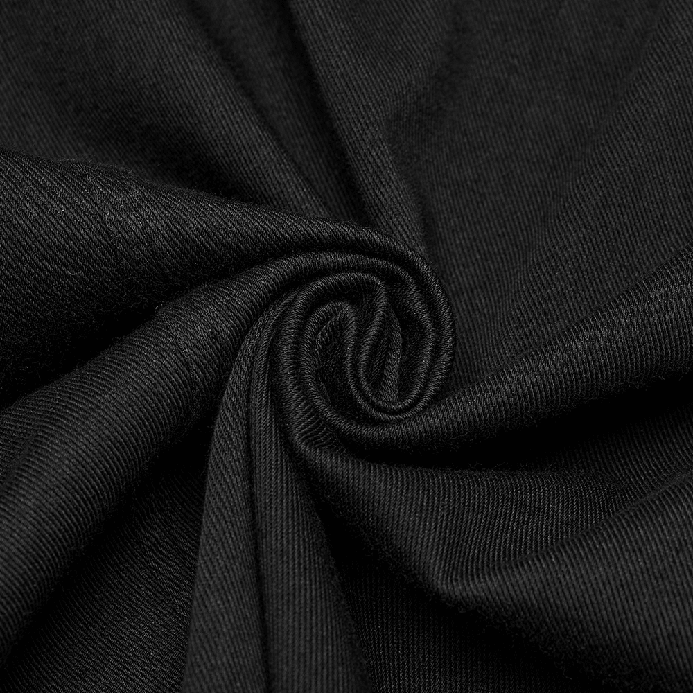 Close-up of soft black denim fabric, showcasing its textured knit for gothic fashion designs and comfortable wear.
