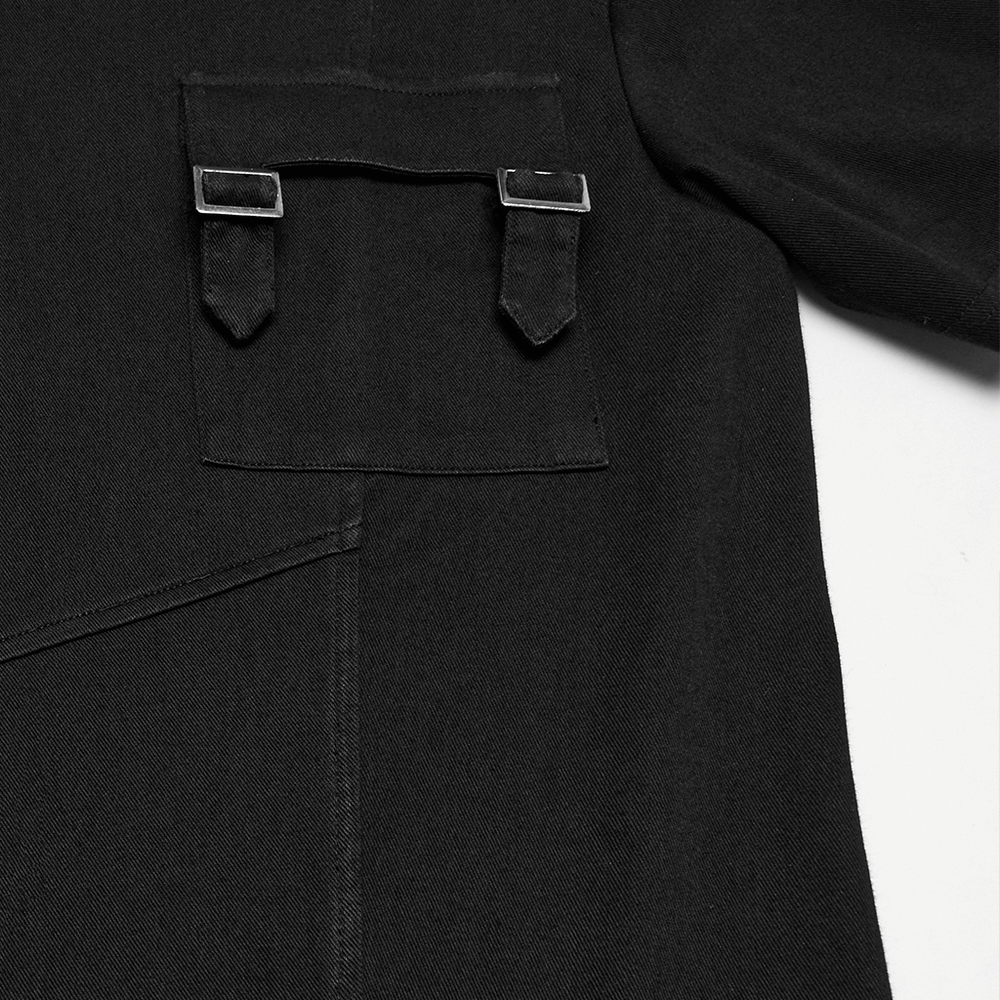 Close-up of black gothic T-shirt showing pocket with buckle detail and layered seams for edgy style.