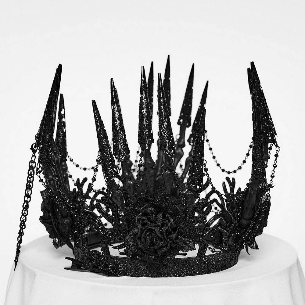 Black Gothic Thorn Crown with Chains and Bone Hands displayed on a table, featuring spikes and roses.