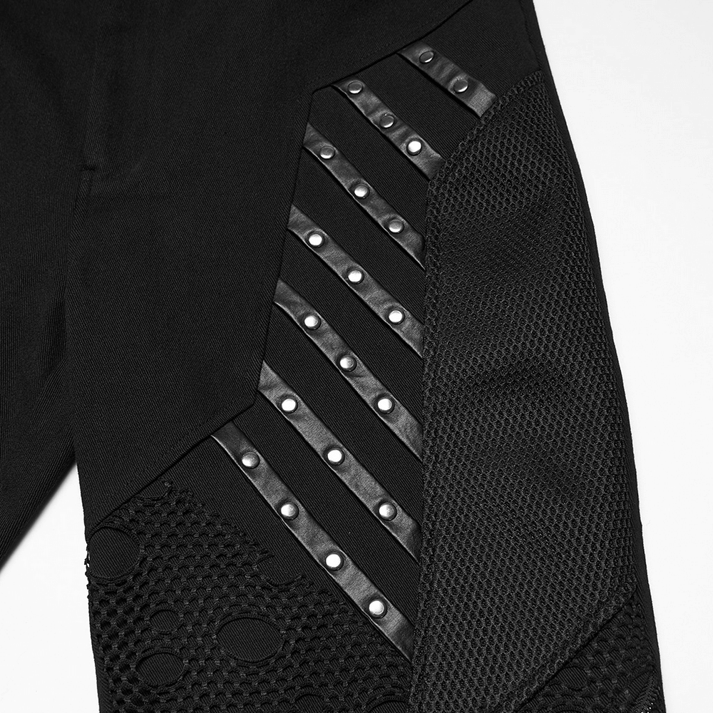 Black Gothic Twill Pants with Mesh and Rivet Detailing featuring unique textures and bold splicing design.