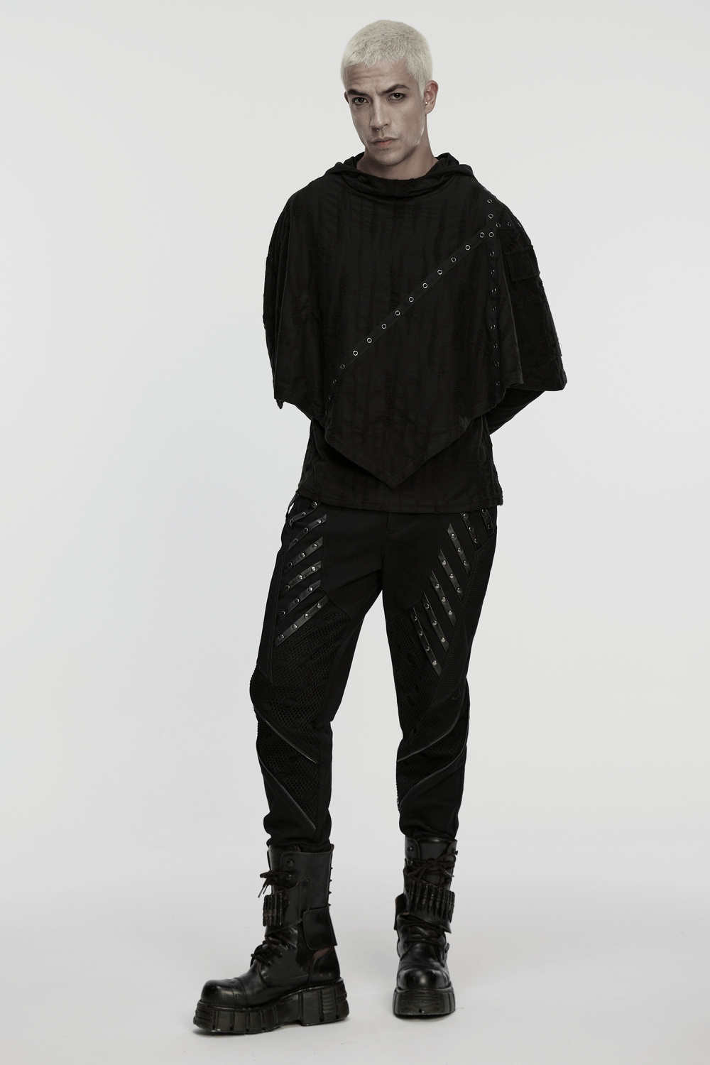 Black Gothic Twill Pants with Mesh and Rivet Detailing worn by a model showcasing a punk-inspired outfit.