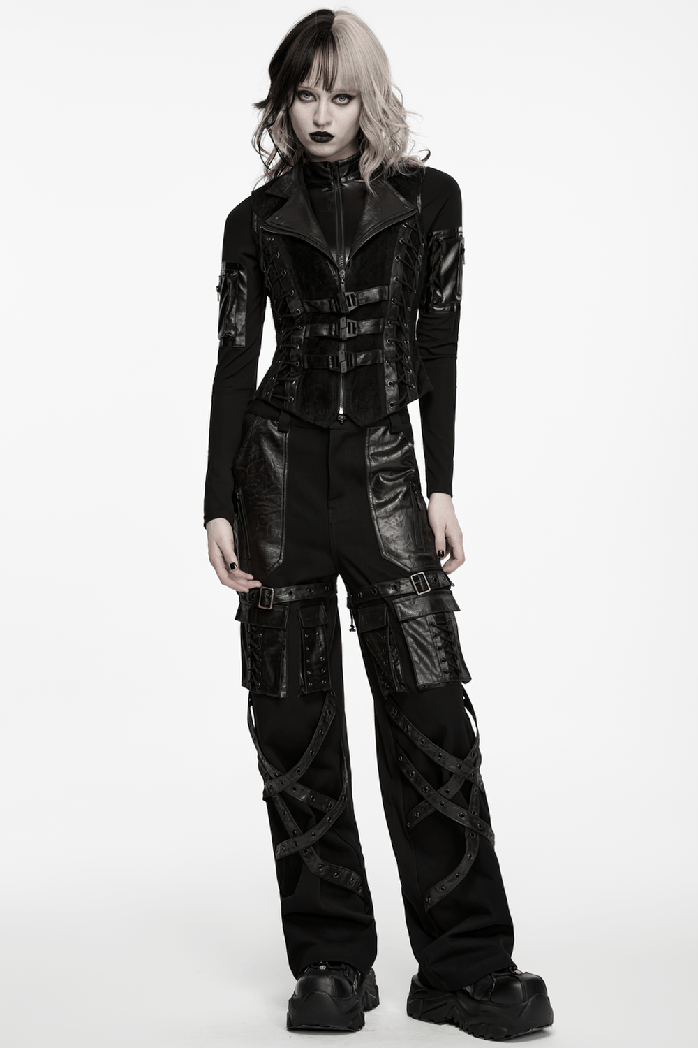 Black Gothic Utility Vest with Buckles and Corset Lacing styled with edgy punk pants for a striking look.