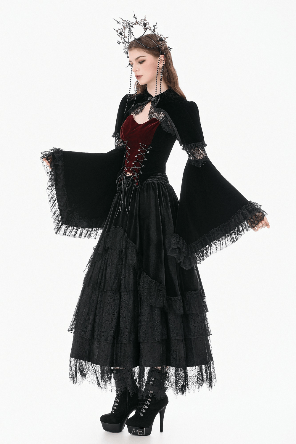 Model in a Black Gothic Velvet Cape with Bell Sleeves and Lace Trim, showcasing Victorian elegance and alternative fashion.