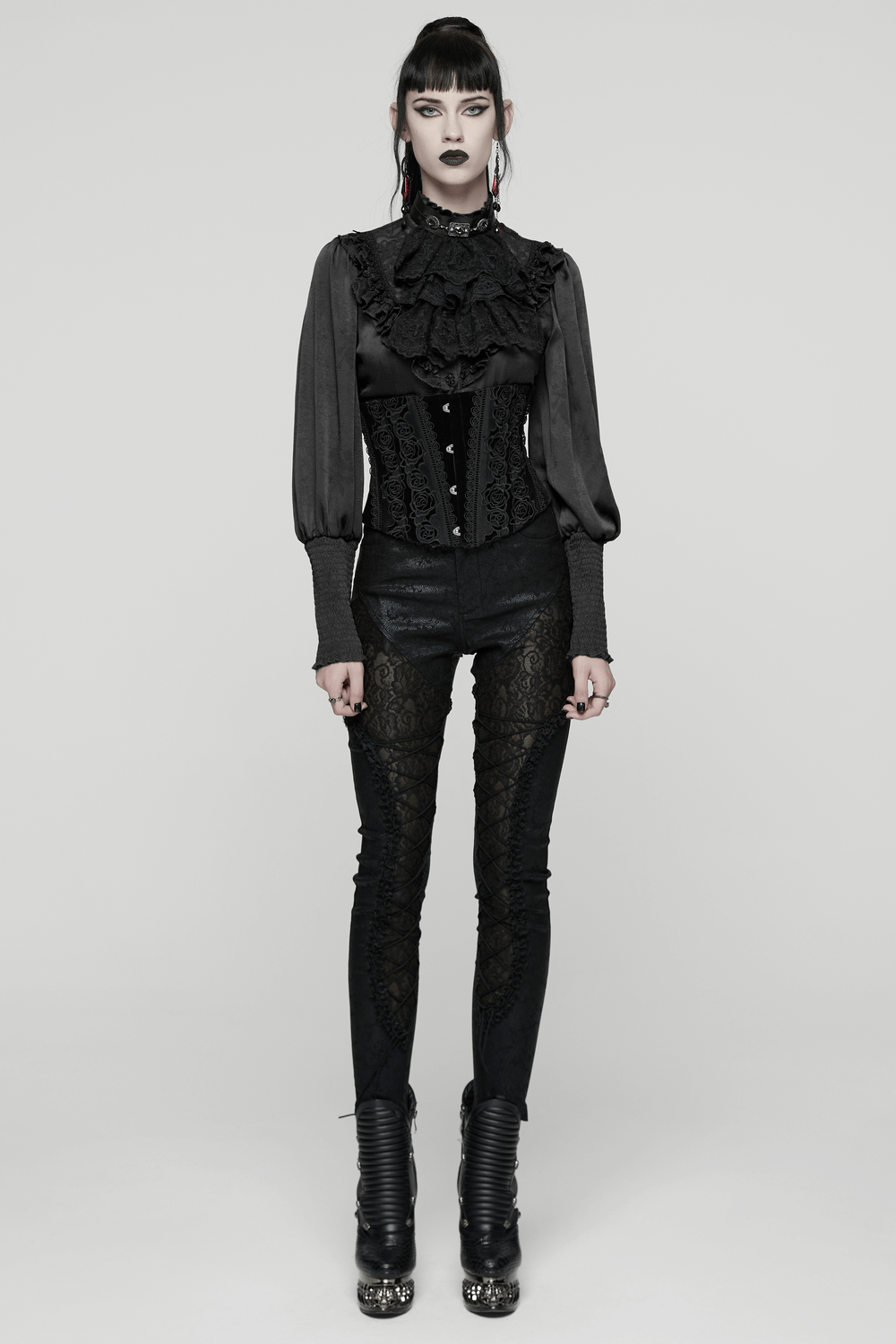 Black Gothic Velvet Corset with Rose Lace Detail worn by a model with dark makeup and ruffled sleeves, showcasing elegance.