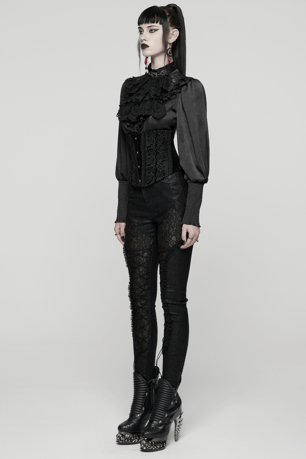 Black Gothic Velvet Corset with Rose Lace Detail worn with stylish black pants and dramatic accessories.