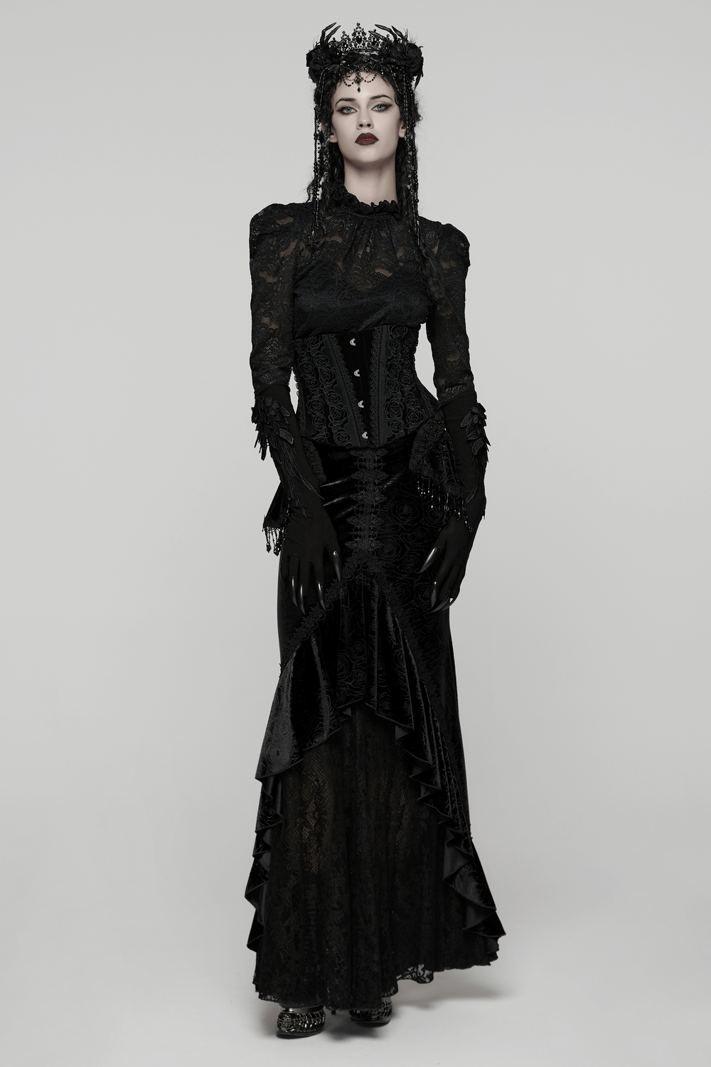 Black Gothic Velvet Corset with Rose Lace Detail worn by model in elegant dark attire.