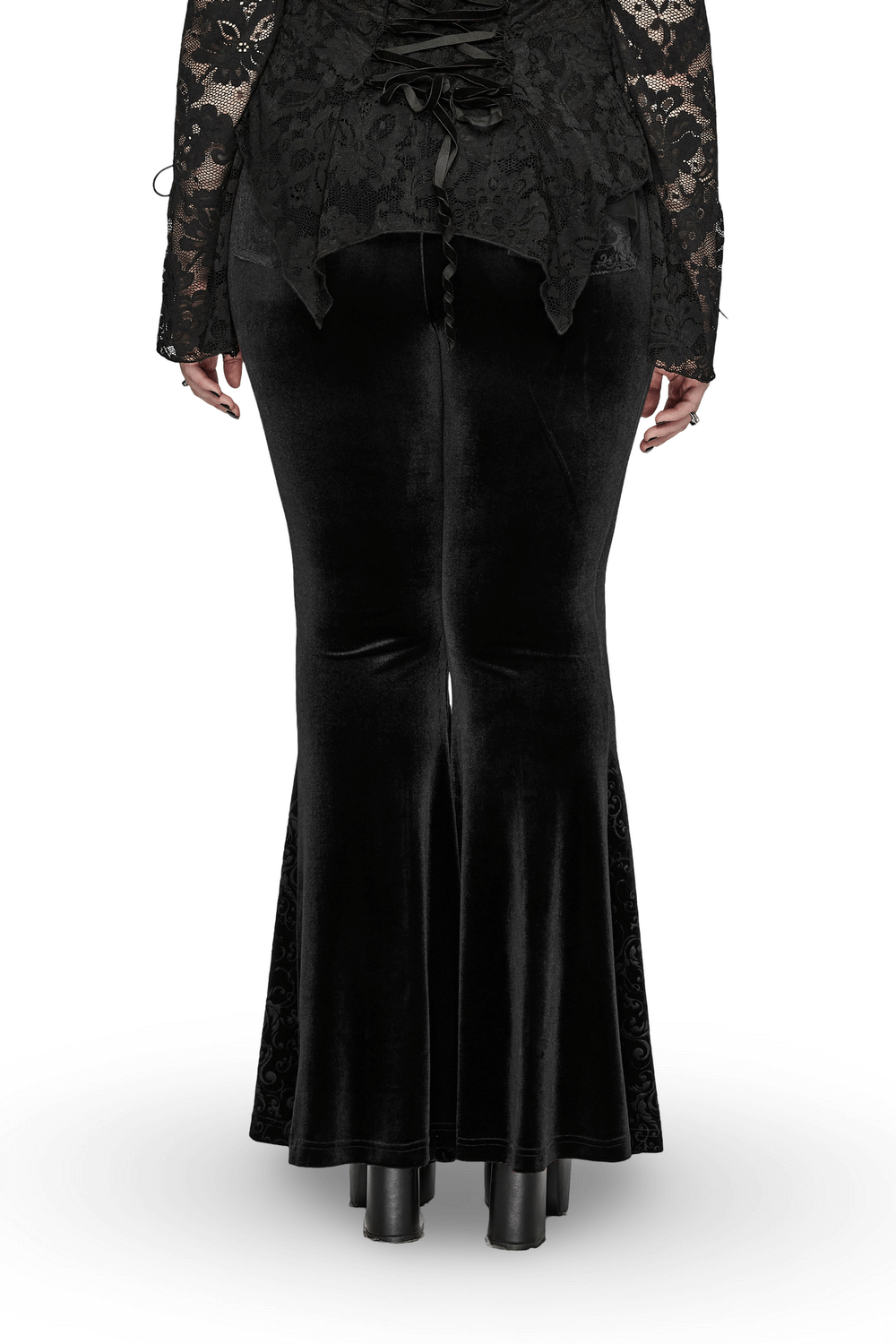 Back view of elegant black gothic velvet flared pants with embossed detailing, showcasing hourglass silhouette.