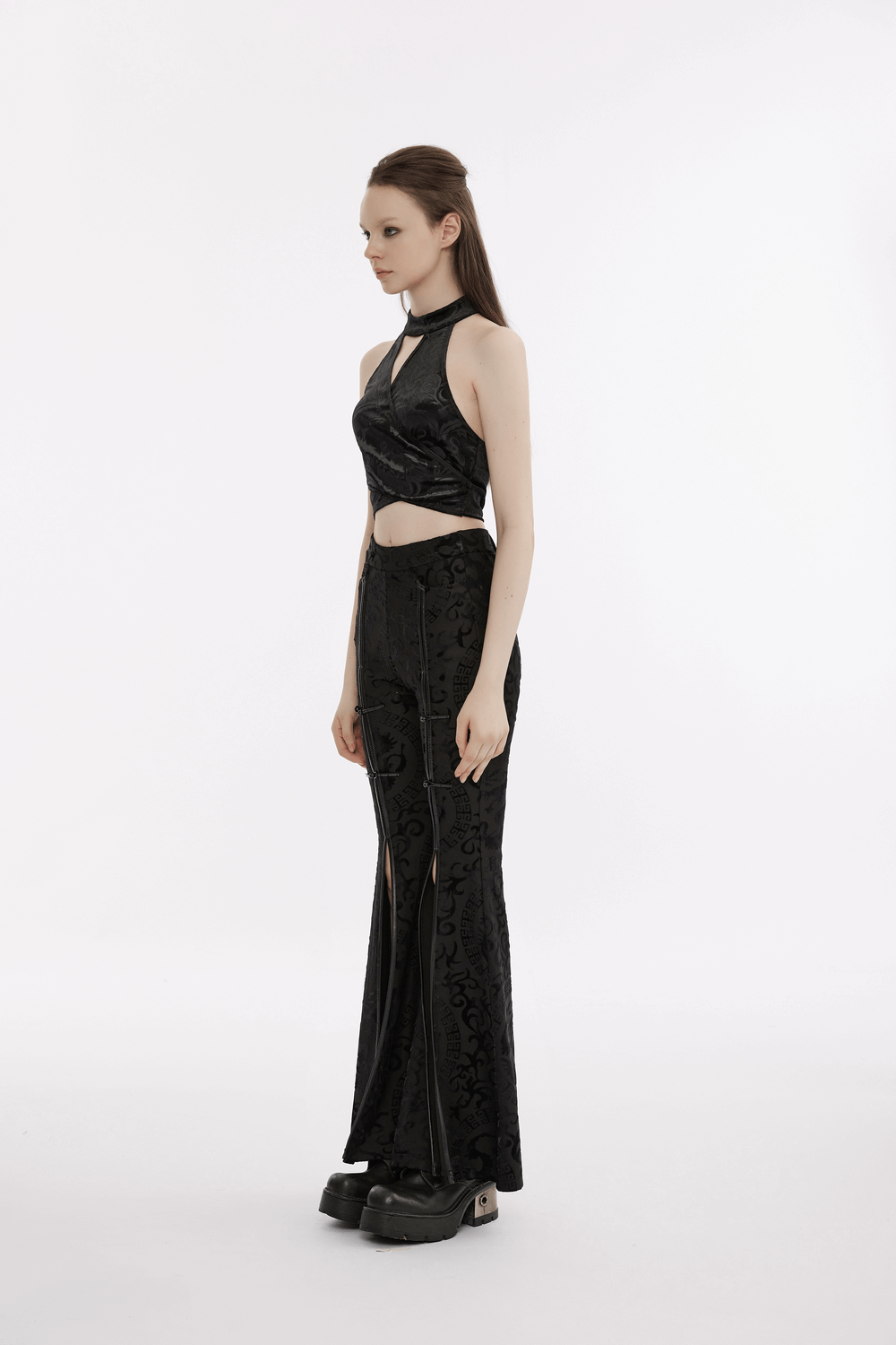 Black gothic velvet halter tank top with back bow and matching flared pants, showcasing elegant punk rock style.