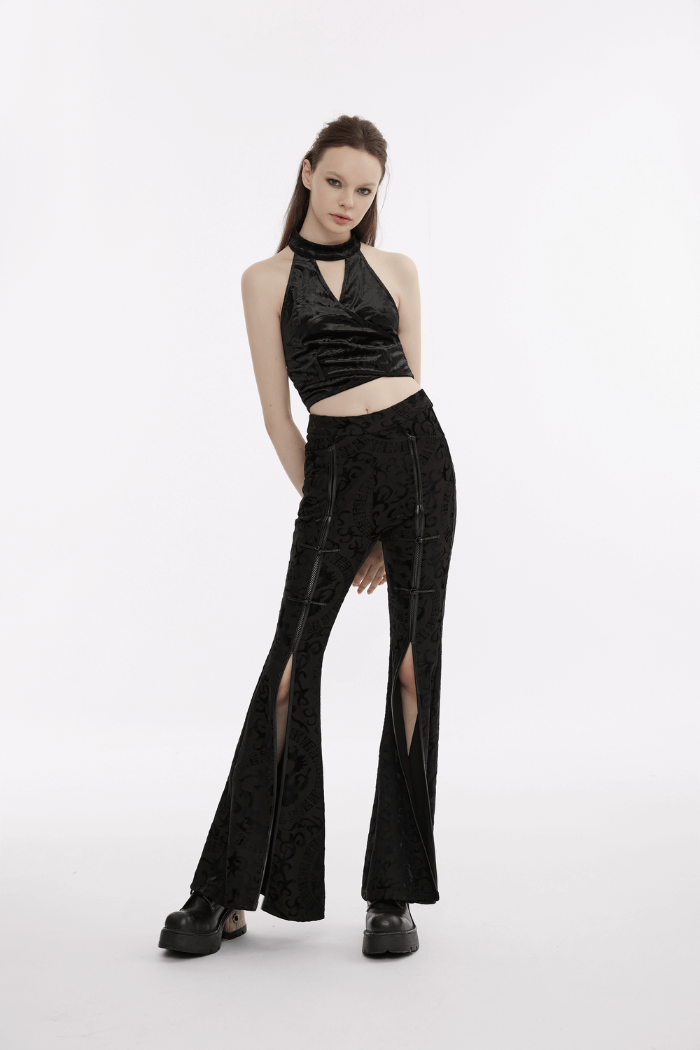 Black gothic velvet halter tank top with back bow, paired with stylish flared pants, showcasing elegant punk aesthetics.