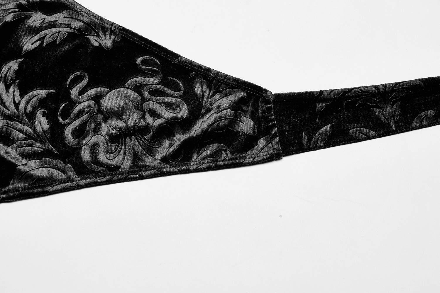 Close-up of black velvet halter tank top featuring an intricate embossed octopus design, perfect for gothic fashion lovers.