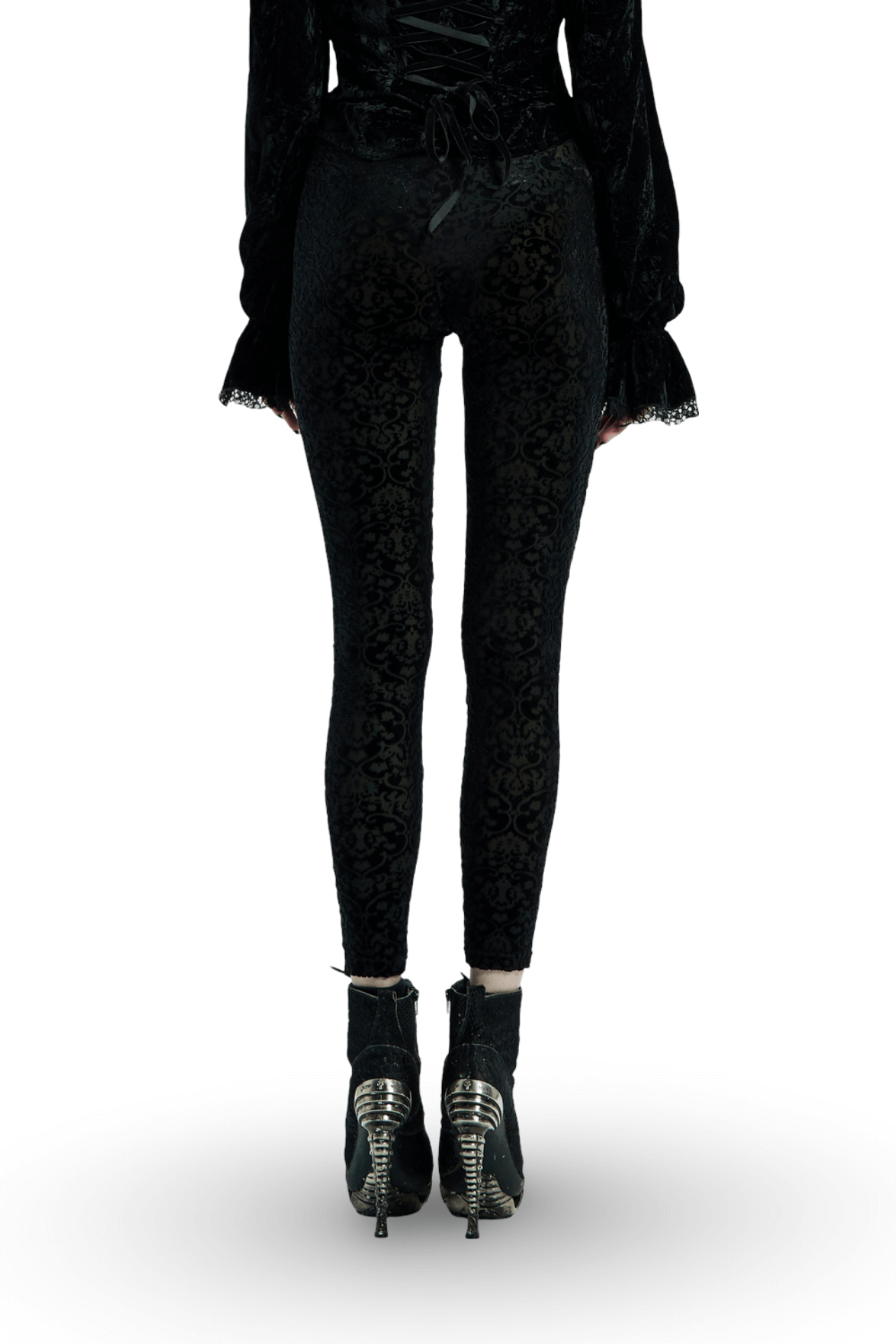Black gothic velvet leggings with floral lace detail, styled with edgy high-heeled boots.