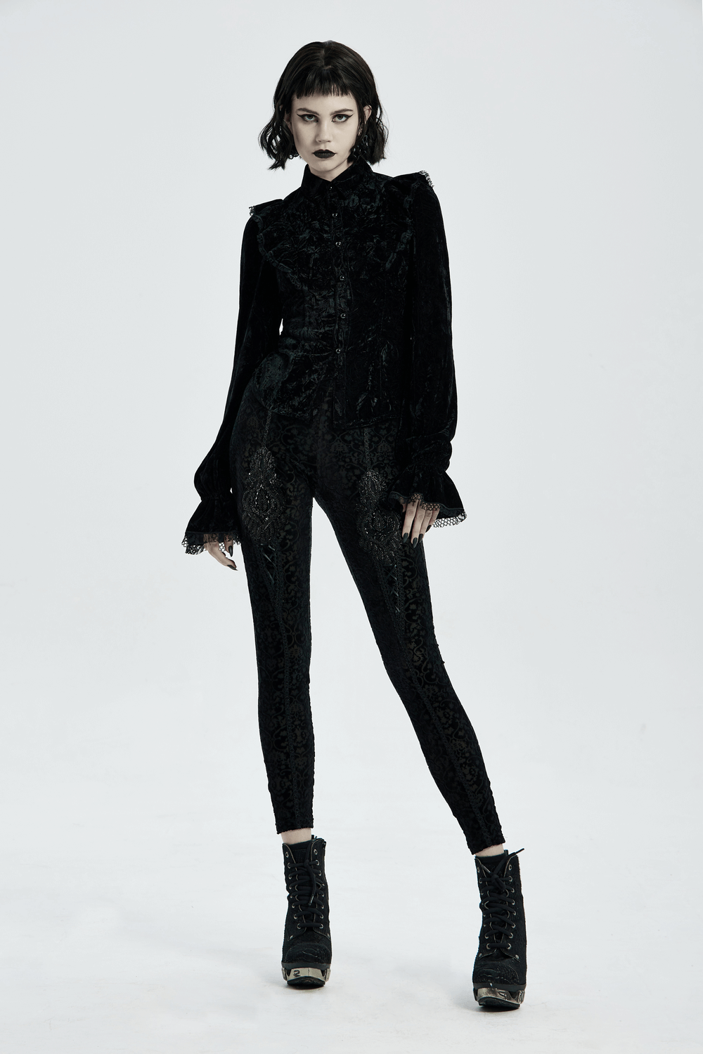 Black gothic velvet leggings with floral lace detail paired with a stylish velvet top, great for elegant gothic fashion.