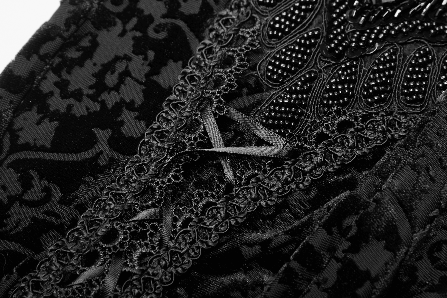 Close-up of Black Gothic Velvet Leggings with Floral Lace and beadwork details, showcasing elegant gothic fashion.